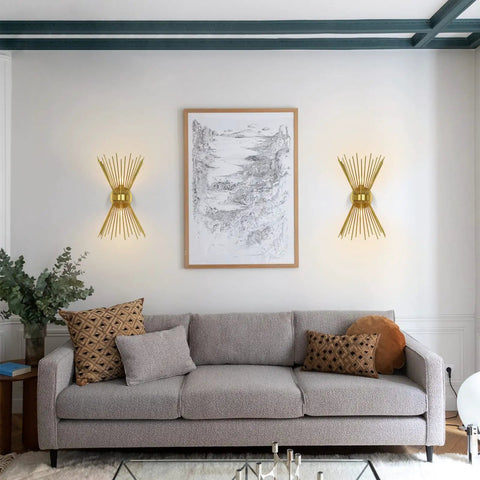 Living room with Brass Mid Century Modern Wall Sconces Set Of 2, Brushed Brass Starburst Wall Lighting above grey sofa.