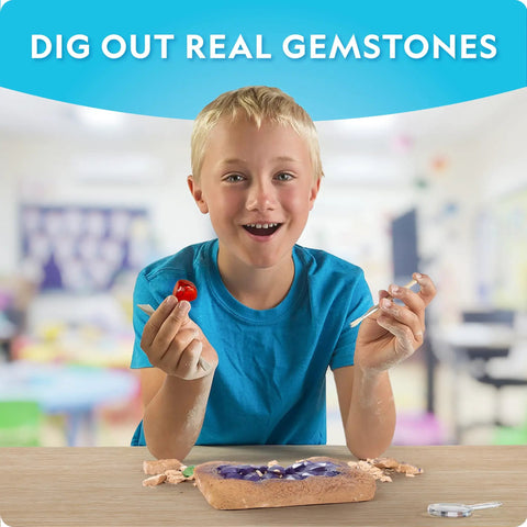Child using Gemstone Dig Kit For Kids With 15 Real Gemstones And Crystals Hands On Science Toy For Boys And Girls. Classroom setting.
