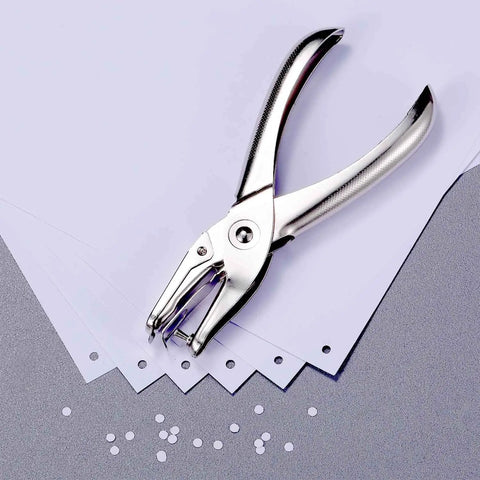 Three Pack Metal Hole Punchers With One Eighth Inch Hole For School, Home And Office showing puncher and punched paper