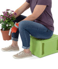 Person sitting on Built Tough 3 Level Work And Garden Seat With Flip Heights At 9, 12 And 15 Inches, weatherproof, green, USA made