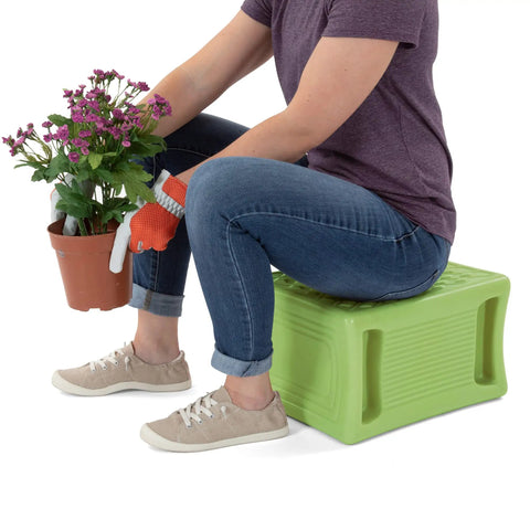 Person sitting on Built Tough 3 Level Work And Garden Seat With Flip Heights At 9, 12 And 15 Inches, weatherproof, green, USA made