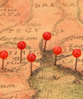 Top Shelf Office Upgrade Supercharge Your Daily Workflow With This Assorted 300 Piece Map Tack Set featuring red bead tops on a map.