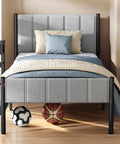 Solid Twin Bed Frame With Hella Comfy Upholstered Headboard And Sleek Metal Footboard Modern Bedroom Essentials featuring gray upholstery and decorative pillows.