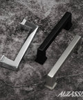 Solid Matte Black Cabinet Pulls Set Of Ten Three And Three Quarter Inch Overall Length With Three And A Quarter Inch Hole Centers, shown with metallic handles