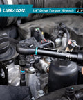 Person using the Bike Torque Wrench One Quarter Inch Drive Five To Twenty Five Newton Meters Micro Click Set in a motorbike engine.