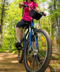 Cyclist on trail with Dope Bike Quick Release Skewers Set For MTB Road BMX Front And Rear Axles 100mm 135mm 120g 1 Pair
