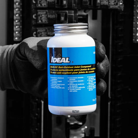 Noalox Heavy-Duty Pro-Grade Anti-Oxidant Compound For Aluminum Electrical Connections, 8 Oz Bottle held in hand