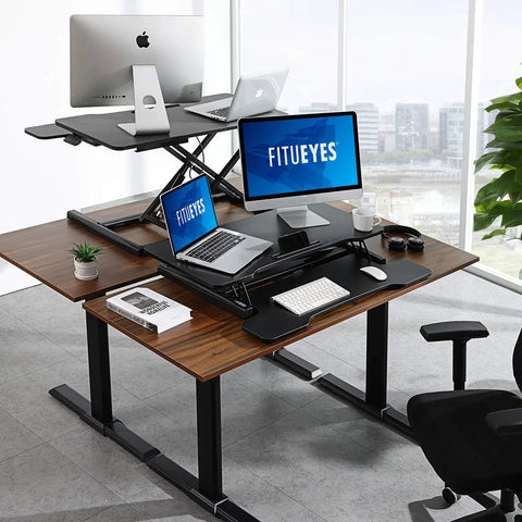 Epic Height Adjustable Sit To Stand Desk Converter For Dual Monitors And Laptop, shown in sleek black finish on wooden desk.