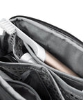 Close-up of Small Wash Pouch Travel Toiletry Bag Weatherproof With Upright Or Hanging Design, showing mesh pockets and magnetic toothbrush pocket.