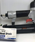 Heavy Duty Pneumatic Brad Nailer 18 Gauge 2 Inch Strip Capacity Smooth Operator For Trim Carpentry And Cabinet Work Ready To Roll, showing tool with brad package.
