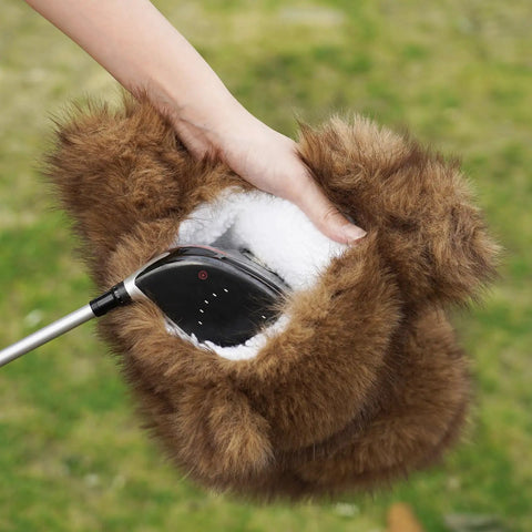 Hand putting driver in Funny Plush Bear Golf Club Head Cover For 460cc Driver Fits Standard Size Universal Fit Ultra Soft Faux Fur