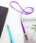 Purple Lanyards For IDs, 100 Pack, 18 Inch Polyester Lanyards with Swivel Hook and Clip shown on table with notebook
