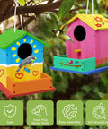 DIY Wooden Bird House Kit For Kids Ages 4 And Up Build And Paint Craft Set With Pre Drilled Pieces Includes Paints And Brushes, Easy To Follow Instructions For Creative Family Fun. two painted wooden birdhouses hanging on tree branches