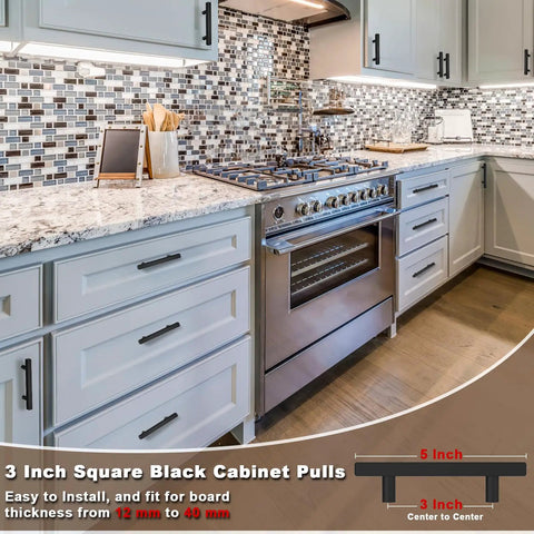 Real Deal Matte Black Cabinet Handles With Slick Square Edges 3 Inch Hole Centers And Heavy Duty Stainless Steel Build For Drawers Dressers And Cupboards In A Thirty Pack in a modern kitchen with granite countertop.