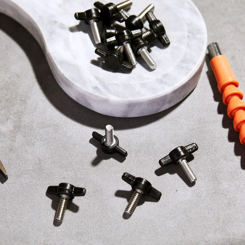 16 Piece Set Of 1/4 20 X 3/4 Inch Round Knob Bolts Made From Top Grade Stainless Steel Thumb Screws on a marble surface.