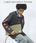 Heavy Duty Canvas Document Holder And Large File Folder Organizer Pouch For Legal And Letter Size Papers With Secure Zipper Closure, army green pouch held by a person.