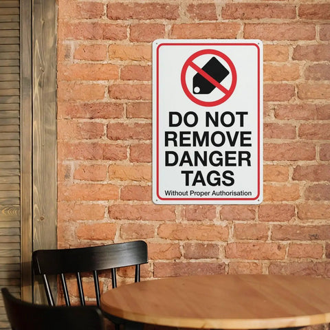Industrial Grade Aluminum Safety Sign 8x12 Inch No Tampering Lockout Caution Plaque on brick wall in shop