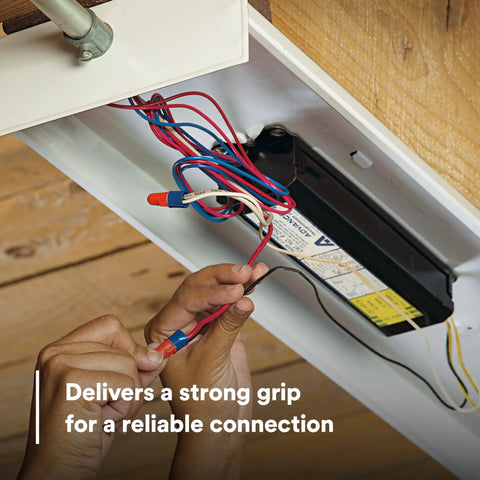 Hands using Two In One Twist On Wire Connector Set 22-12 AWG Orange Blue Pouch Of 100 to secure wires in light fixture.