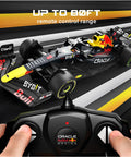 Licensed Red Bull F1 RB18 One Eighteen Scale Remote Control Car With Realistic Detail shown with remote controller in use