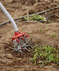 Disc Cultivator Heavy Duty Garden Tool With ComfortGEL Grip Adjustable Six And A Half Inch Metal Tines in use for weeding