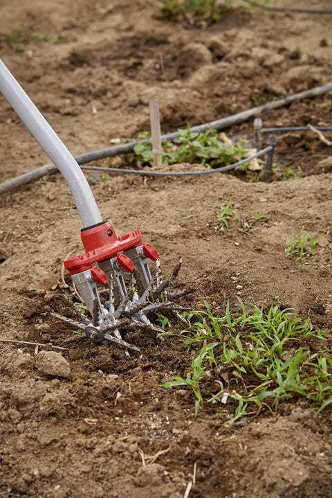 Disc Cultivator Heavy Duty Garden Tool With ComfortGEL Grip Adjustable Six And A Half Inch Metal Tines in use for weeding