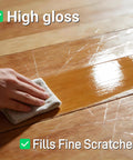Hand applying Top Shelf Wood Floor Restorer And High Gloss Polish For Fresh Slick Shine to wood floor, highlighting high gloss and scratch filling.
