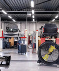 Kick Serious Heat To The Curb With This Heavy Duty 42 Inch Portable Barrel Fan pumping 11044 cfm in an auto repair shop.