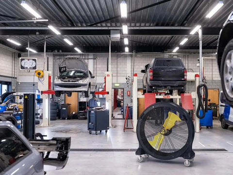 Kick Serious Heat To The Curb With This Heavy Duty 42 Inch Portable Barrel Fan pumping 11044 cfm in an auto repair shop.