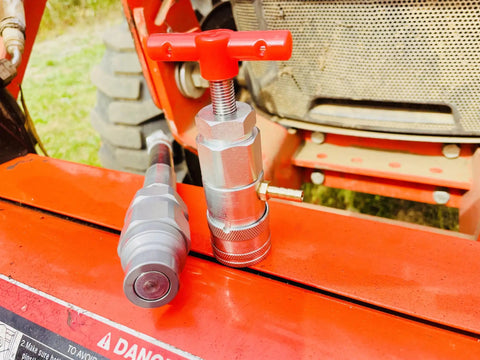 Half Inch ISO 16028 Flat Face Skid Steer Male Hydraulic Quick Coupler Pressure Decompression Relief Release Tool shown on equipment