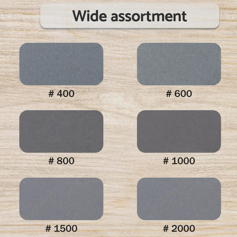 6-grit samples of 5 Inch Wet Dry Sanding Discs Hook And Loop 60 Pcs Silicon Carbide Grit 400 600 800 1000 1500 2000 on wood surface