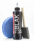 Turn Heads Rich Black Tire Shine And Trim Restorer With Ceramic Hybrid Shield, bottle with applicator and microfiber pad.