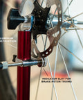 Close-up of Pro Truing Stand With Thru Axle Adapter Compact Portable Aluminum Single Arm Design showing indicator slot for brake rotor truing.