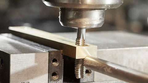 Top Shelf 1/2-13 Plug Tap And 27/64 Inch Drill Bit Combo Set For Nailing Right Hand Internal Threads And Cranking Out Precision Holes With Zero Hassle Today in use on a workpiece.