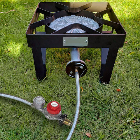 Propane regulator with 12-ft braided hose and 30 PSI gauge connected to outdoor burner on black metal stand