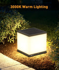 Outdoor Solar Post Cap Light with Warm 3000K LED illuminating a garden area at night, IP54 waterproof, die-cast steel.