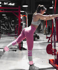 Badass Leg Straps For Cable Machines And Home Gym Hustle, dual pack heavy duty cuffs with neoprene padding in use during leg workout.