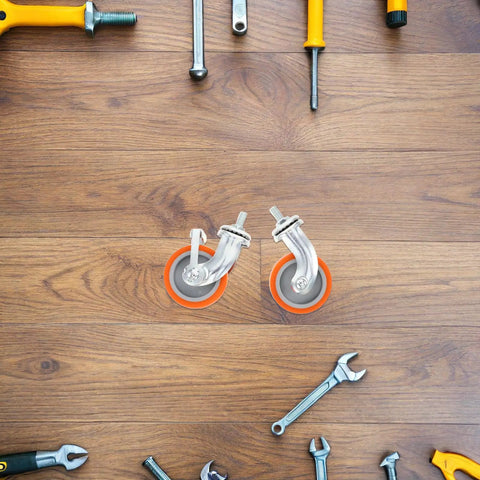 4pcs Inch M8 TPR Rolling Furniture Casters with Brake Orange displayed on a wooden surface surrounded by tools.