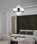 Sleek 10 Light Polished Nickel Pendant Chandelier Featuring Clean Drum Shade And Sparkling Clear Crystal Rods To Bring Major Luxe Vibes To Your Awesome Home in a modern bedroom.