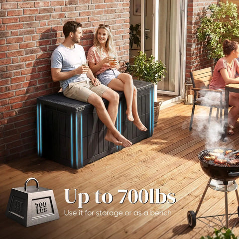 Couple sitting on Huge 120 Gallon Resin Deck Box Weatherproof Outdoor Storage Bench Heavy Duty Lockable Container For Garden Tools Pool Gear