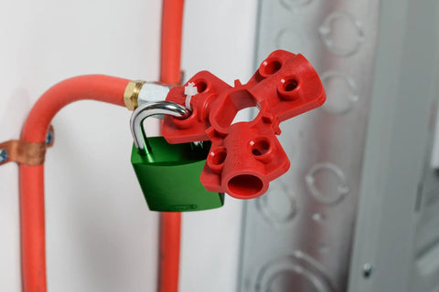 Quick Disconnect Pneumatic Lockout System For Lockout Tagout securing six padlocks on red fittings for safe energy shutdown.