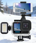 GoPro Hero Waterproof Case With Floating Hand Grip 196ft Depth Rated underwater housing with camera and phone mount in snowy backdrop
