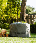 All Season Weatherproof Round Fire Pit Cover With Beefed Up Aluminum Reinforcement And PVC Coated Polyester Shield For Yukon Fire Pit And Accessories in backyard