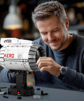Man assembling Hands On Electric Turbofan Engine Model Kit With Motor For STEM, 1813 Pcs Aircraft Engine Building Set That Actually Runs