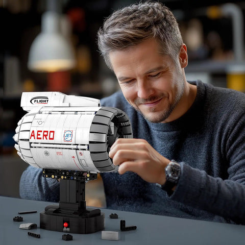 Man assembling Hands On Electric Turbofan Engine Model Kit With Motor For STEM, 1813 Pcs Aircraft Engine Building Set That Actually Runs
