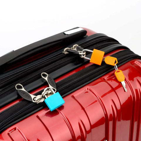 4 Pack Multicolor Keyed Padlocks For Suitcases And Luggage With Two Distinct Keys; orange and blue locks securing suitcase zipper