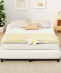 Rock Solid Full Size Bed Frame With Heavy Duty Steel Slat Support Ultra Low Profile Platform Design viewed with a yellow blanket and decorative pillow.