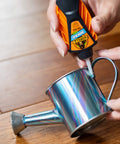 Using Micro Precise Gel Glue With Quick Set Cyanoacrylate Adhesive, Anti Clog Cap, Clear Finish, Precise Dispensing Tool on metal object.