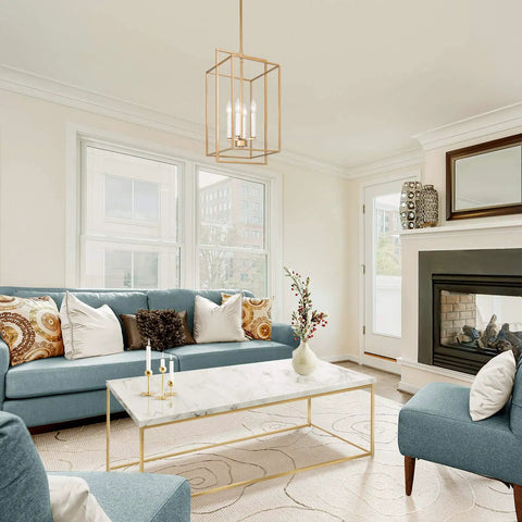 Antique Gold Four-Light Modern Linear Chandelier With Openwork Geometric Frame in living room setting over marble table