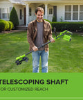 Man holding a telescoping shaft of the Versatile 40V Cordless String Trimmer And Edger With 13 Inch Cutting Deck for customized reach.