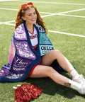 Cheerleader with Blue Purple Throw Blanket 50x60 Inches With Inspirational Quotes Grid Design sitting on grass.